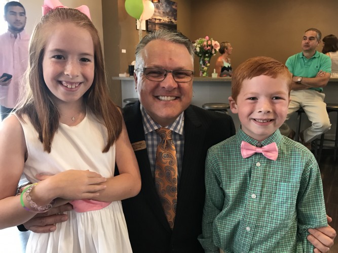 Pastor Mark with two children