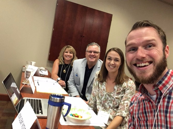 Andy taking selfie of group during bootcamp meeting